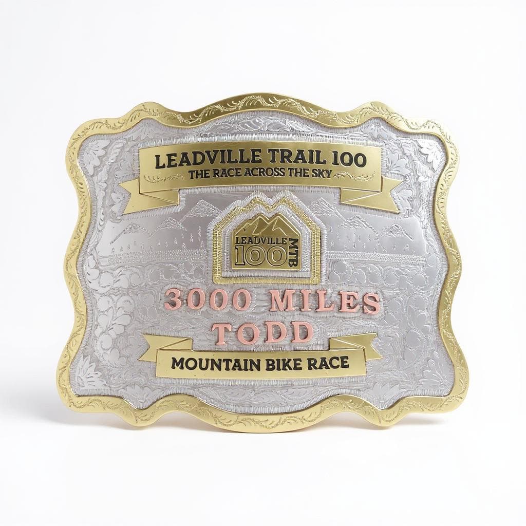 Leadville Trail 100 commemorative belt buckle, silver and gold ornate engraving.